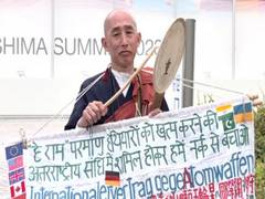 
      
      Buddhist Monk holds protest outside G7 International Media Centre
      
      
