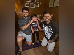 
      
      IPL: Rinku Singh, Nitish Rana pose with Abdu Rozik
      
      