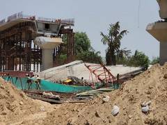 
      
      Crane operator dies after span of under-construction flyover fell
      
      