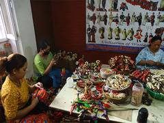 
      
      Nepali women recycle corn husk into works of art
      
      