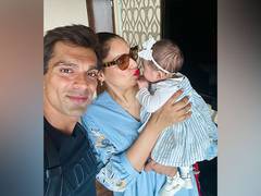 
      
      On Father's Day, Bipasha shares a cute video of Karan with Devi
      
      