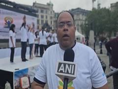 
      
      UK: People perform yoga at Trafalgar Square in London
      
      