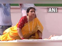 
      
      Mumbai: BJP's Chitra Wag performs yoga in Nauwari Saree
      
      