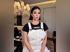 
      
      Kourtney Kardashian flaunts baby bump in green bikini
      
      