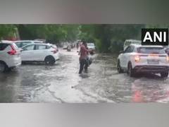 
      
      Rainwater gushes down a street in Rajasthan's Jodhpur
      
      