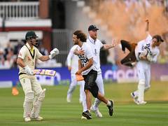 
      
      Climate protestors disrupt second Ashes Test 
      
      