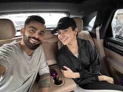 
      
      Anushka poses with Virat as they 