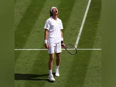 
      
      Wimbledon: Andrey Rublev rallies past Aslan Karatsev
      
      