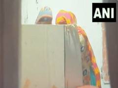 
      
      WB: In viral clip, woman seen helping voter inside booth
      
      