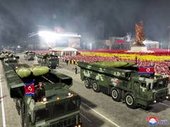
      
      N Korea’s Kim displays attack drones at military parade
      
      