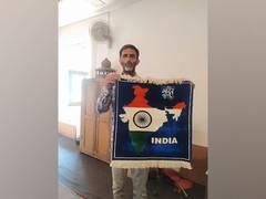 
      
      Kashmiri craftsman's silk carpet honors India's map
      
      