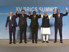
    15th Brics Summit: PM Modi, Xi stand apart in family photo
    