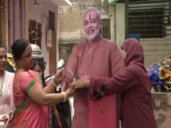 
      
      Women from different communities tie Rakhi to PM Modi
      
      