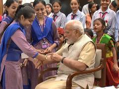 
      
      Delhi: Schoolgirls tie Rakhi to PM Modi on Raksha Bandhan
      
      