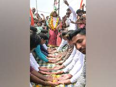 
      
      MP: Braveheart's wife walks on villagers palms
      
      