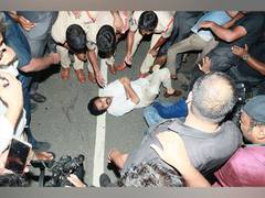 
      
      JSP chief Pawan Kalyan lies down on road after being stopped
      
      