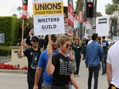 
      
      Hollywood writers strike officially ends after 148 days
      
      