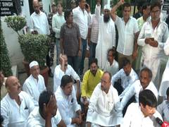 
      
      AAP workers gather outside Sanjay Singh's residence
      
      