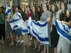 
      
      Israelis celebrate at Tel Aviv airport, as they welcome soldiers
      
      