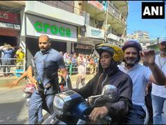 
      
      Rahul Gandhi rides pillion on scooter to meet former Mizoram CM
      
      