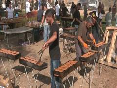 
      
      Volunteers serve soldiers through open kitchen, salon in war zone
      
      