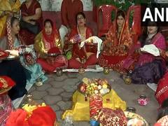 
      
      Women perform rituals on the occasion of Karwa Chauth in Gwalior
      
      
