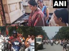 
      
      Chhattisgarh: Smriti Irani rides scooty, prepares tea for workers
      
      