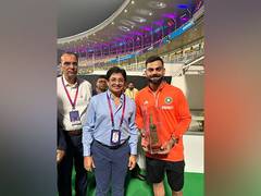 
      
      CAB president presents golden-plated bat to Virat Kohli as gift
      
      