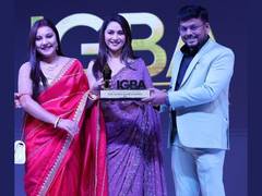 
      
      Tapas Biswas , Angita Biswas Receive Award from Madhuri Dixit 
      
      