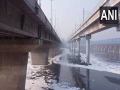 
      
      Toxic foam floats on the surface Yamuna river as Chhath Pooja asc
      
      