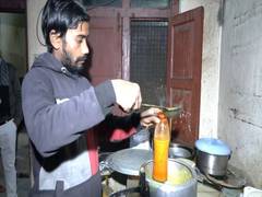 
      
      Khichdi being filled in cylindrical bottles for trapped workers
      
      
