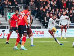 
      
      Manchester City secure 2-1 victory over Luton Town
      
      