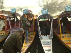 
      
      J-K: Tourists enjoying 'Shikara' ride at frozen Dal Lake
      
      