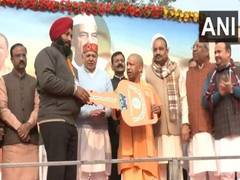 
      
      Lucknow: UP CM Yogi Adityanath gifts tractors to farmers 
      
      
