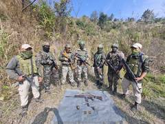 
      
      Assam Rifles and Mizoram police recover weapons, war-like stores
      
      