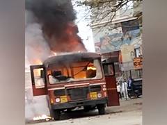 
      
      Bus burnt in Jalna, state transport halts services
      
      