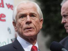 
      
      Former Trump aide Peter Navarro reports to prison in Jan 6 case
      
      