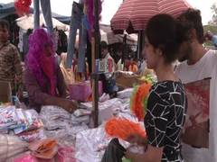 
      
      Shoppers throng Delhi markets ahead of Holi
      
      