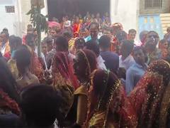 
      
      Men embrace women's attire as part of Holi celebration
      
      