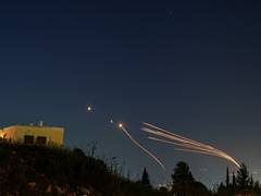 
      
      Hezbollah fires dozens of missiles towards northern Israel
      
      