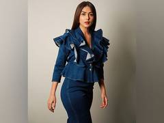 
      
      Mrunal Thakur stuns in ruffled top and denim combo
      
      