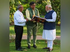 
      
      PM Modi receives Panchjanya's book 