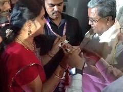 
      
      Karnataka CM receives  garland made of free bus tickets 
      
      