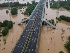 
      
      Southern China battered with massive floods; 4 killed
      
      