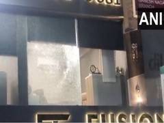 
      
      One held after incident of firing was reported at car showroom
      
      