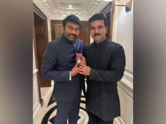 
      
      Ram Charan strikes a pose with Chiranjeevi's Padma Vibhushan
      
      