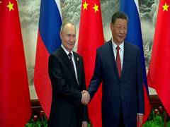 
      
      Putin receives red-carpet welcome in Beijing for talks with Xi
      
      