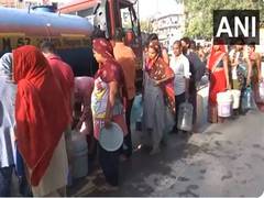 
      
      People wait in long queues as water crisis continues in Delhi 
      
      