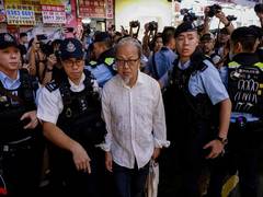
      
      Hong Kong police arrest street artist hours before anniversary
      
      