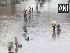 
      
      Delhi rain: Traffic crawls, people wade through waterlogged areas
      
      
